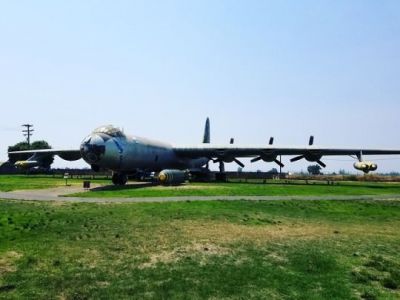 A B-36 sitting on display with a replica hydrogen fusion bomb for show.